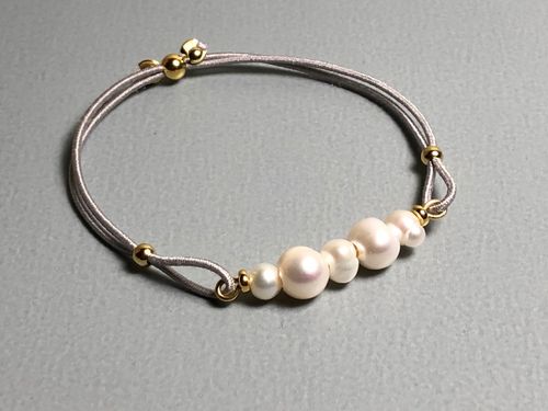 Elastisches Armband mit Perlen Silberelemente